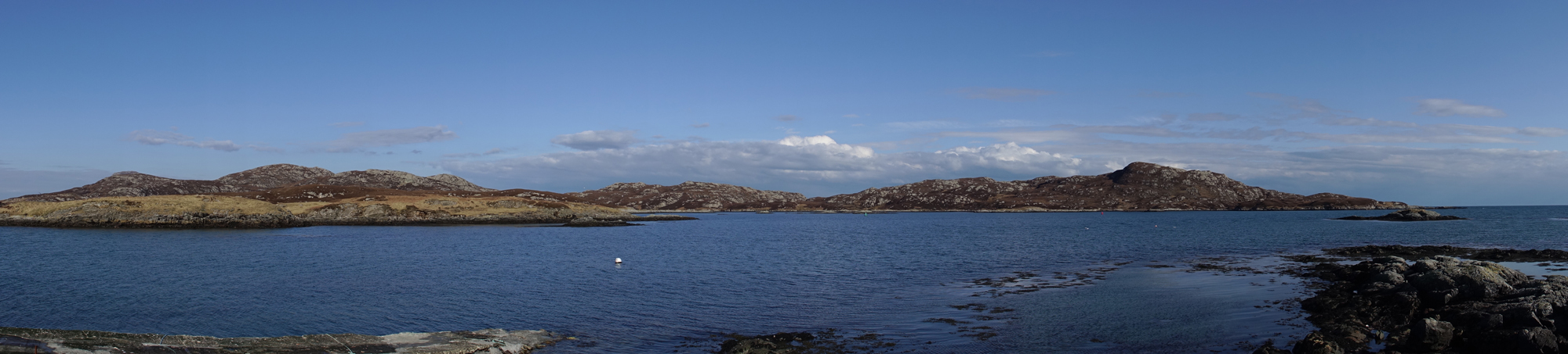 View past Kallin Harbour, Grimsey, North Uist.